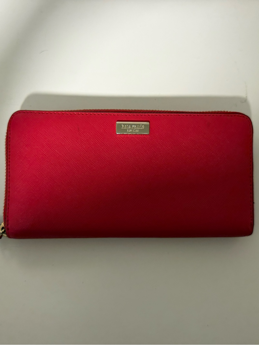 kate spade bright red zip-around wallet with gold logo